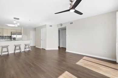 Unfurnished living room with ceiling fan with nota