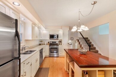 Newly remodeled kitchen with tiled backsplash, pro