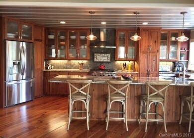Large granite bar. Original reclaimed cabinetry.