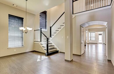 Gorgeous upscale tile flooring enhances this large dining room and open floor plan.