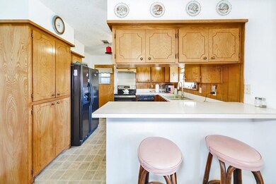 Kitchen with a sink, stainless steel electric stov