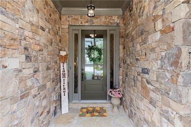 Elegant and welcoming entrance with brick detail.