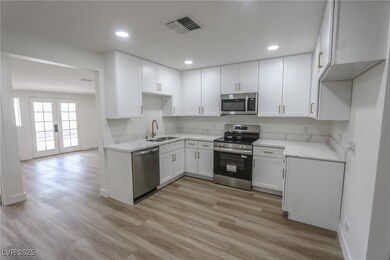 Kitchen featuring appliances with stainless steel