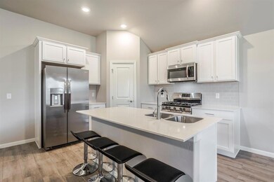 Kitchen with appliances with stainless steel finis