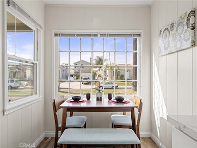 Sunny dining are overlooks the greenbelt through the large picture window.
