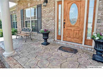 Beautiful front door and stone front porch.