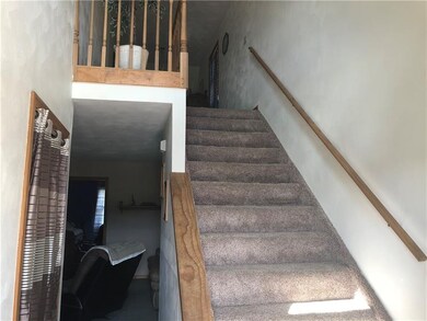 Entry into the family room and upstairs to the lof