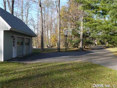Parking Lot/Garage. View of driveway coming in fro
