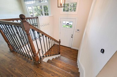 Entryway featuring wood finished floors and healthy amount of natural light