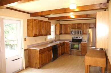 Kitchen with wonderful window over the sink. Stain