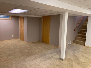 Large family room with storage / utility room.