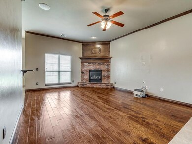 Spacious living room with gas fireplace.