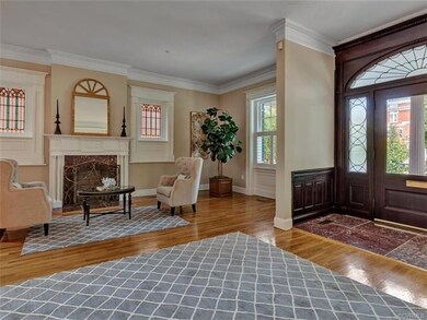 Reception hall with stained glass windows flanking the  fireplace.