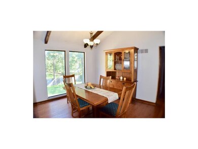Separate dining room just off kitchen with picture