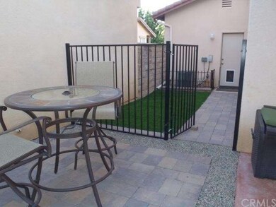 sitting area with gated dog run