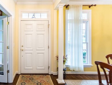 Classic entry flanked by office and formal DR