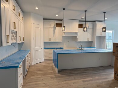 Kitchen featuring sink, hanging light fixtures, a 