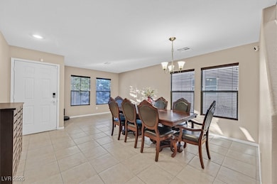 Dining area featuring a chandelier, visible vents,