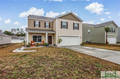 FRONT OF HOME WITH GARAGE AND FRONT PORCH VIEWS