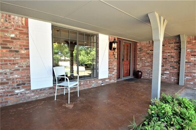 Beautiful open porch on this classic style ranch h