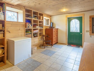 The tiled ground level mudroom is a...