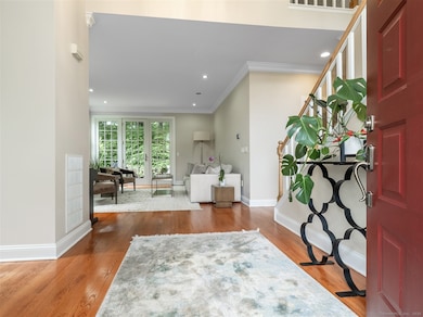 Spacious front foyer opens to the living room.