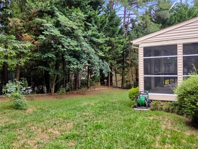 View of yard with a sunroom