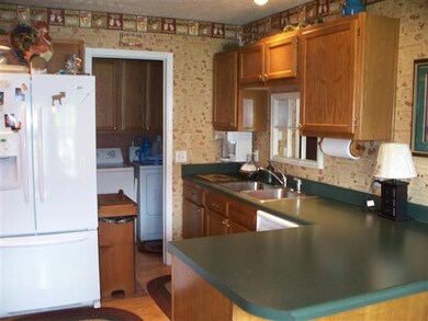 Kitchen with appliances including new side by side refrigerator and Large pantry.