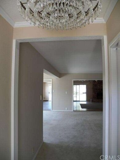 Continued long and deep Entry view to Living room 