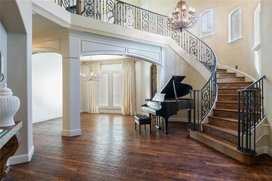 Gorgeous grand entrance with scraped hardwood floo