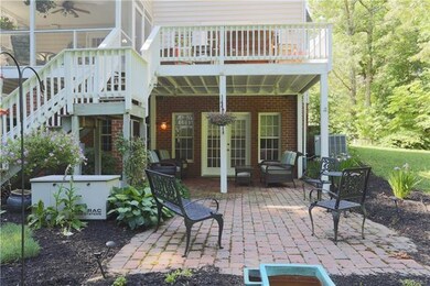 Rear View showing Covered Patio, Screened Porch & Upper Level Deck