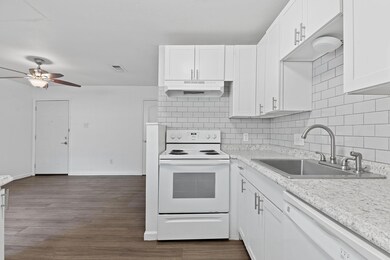 Kitchen featuring white appliances, under cabinet