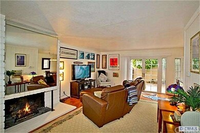 Open and bright living room with gas fireplace.