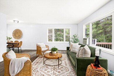 Living room with wood-type flooring