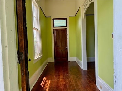 Enter into a formal foyer with access to the side