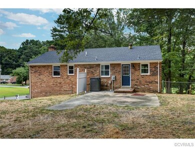 Rear of home with concrete patio, newer HVAC unit,