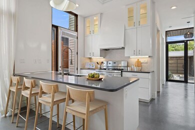 Kitchen with high end stainless steel range, dark