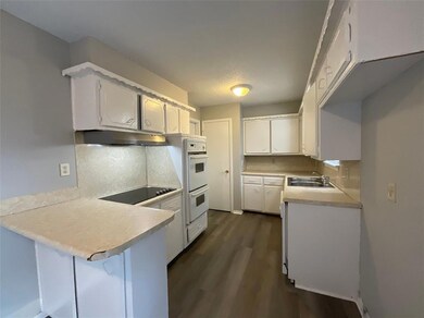 Kitchen featuring dark hardwood / wood-style floor