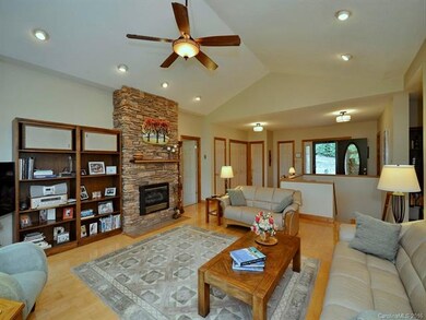 Cathedral Ceiling and Stone Fireplace in Living Ro