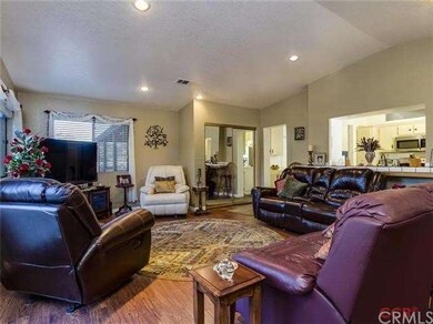 Family room opens up to the kitchen's pass through