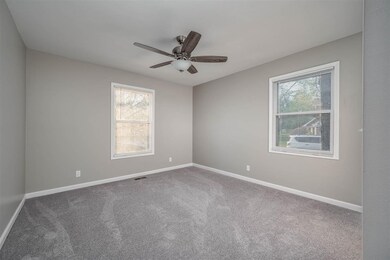 Bedroom 1- flooded with natural light and a ceilin
