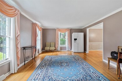 Formal Living Room features gleaming hardwood floo