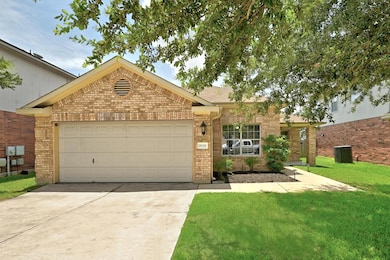 Single story home featuring brick siding, drivewa