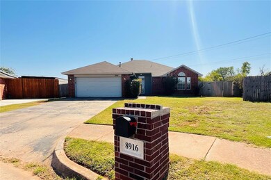 Single story home featuring a garage and a front l