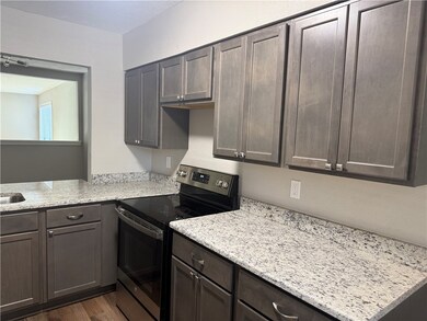 Kitchen featuring stainless steel range with elect