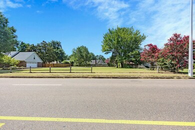 View of asphalt street with sidewalks and curbs