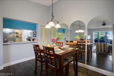 Dining space with a chandelier, wood finished floo