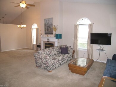 The open living room and dining room share a gas f