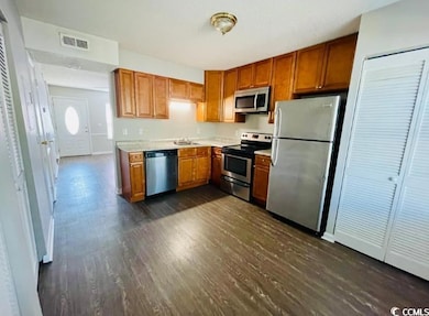 Kitchen with appliances with stainless steel finis