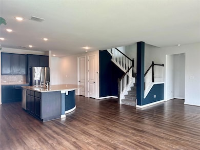 Kitchen featuring stainless steel appliances, dar